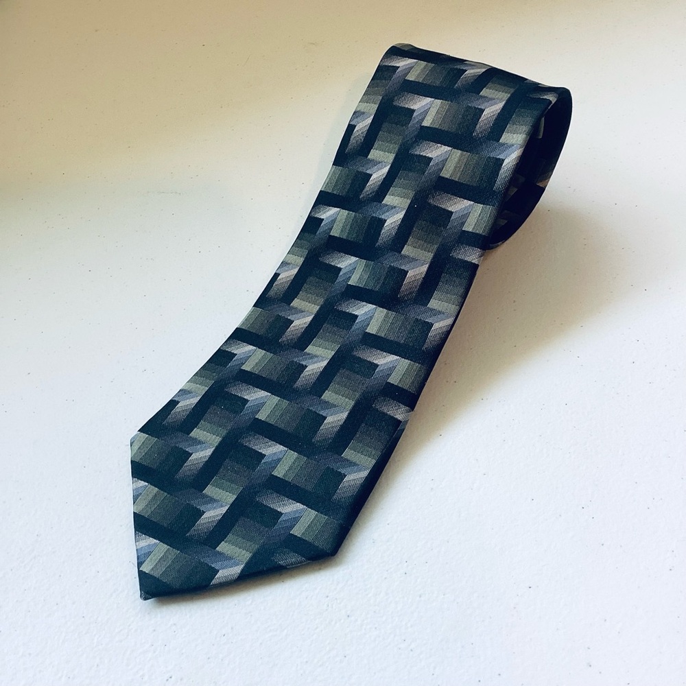 Beautiful silk tie by George.  Blue, green & black geometric designs. 58” L 4” W